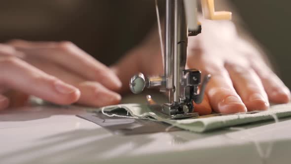 The Sewing Machine is Sewing Lightcolored Linen