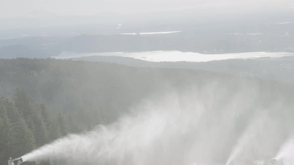 View of Top of Grouse Mountain Ski Resort with the City in the Background alt