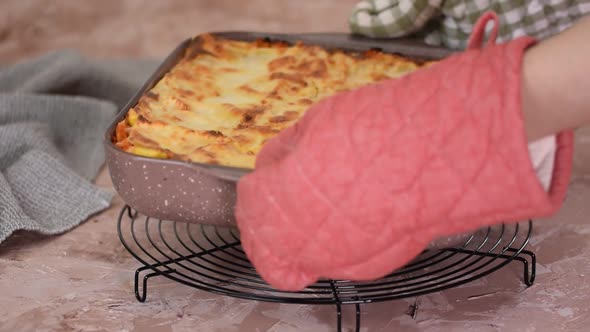 Baking dish with tasty lasagna and minced beef bolognese sauce.