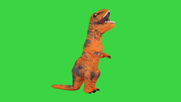 Funny Dancing of a Man in a Dinosaur Costume on a Green Screen Chroma Key