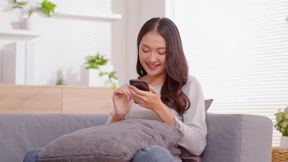 Happiness Entrepreneur beautiful business asian young woman wear casual use mobile phone for shoppin alt