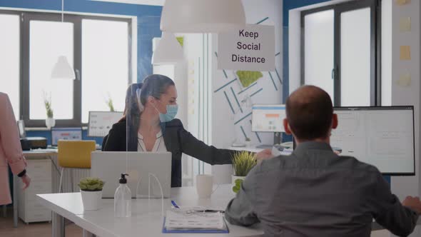 Close Up of Two Coworkers Talking About Marketing Project alt