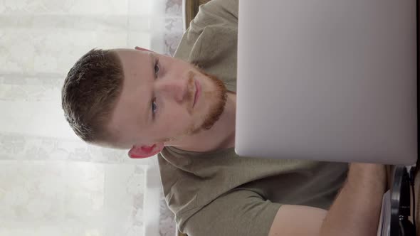 Vertical Shot Young Handsome Man Works at Laptop From Home Studying Online Surfing Net