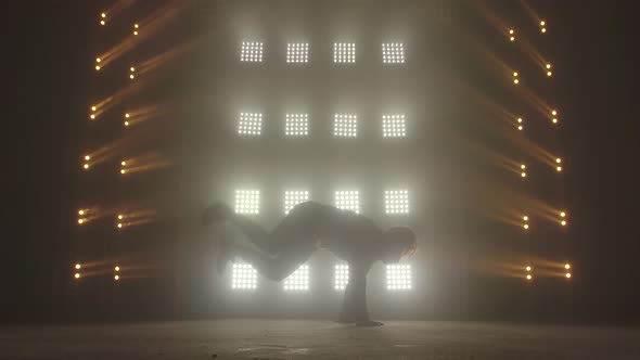 Breakdance Concept. Trendy Young Man Dancing Single in Club, Neon Light, Lots of Smoke. Fashion alt