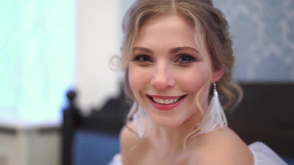 Beautiful Blonde Bride Poses Closeup in a Chic Rich Indoor