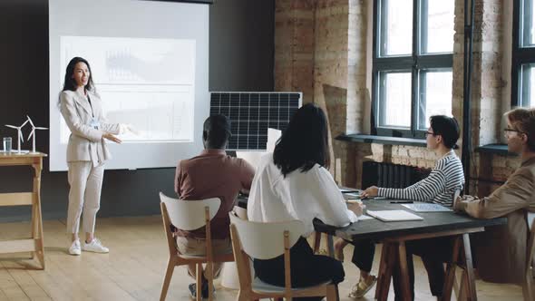 Businesswoman Presenting Renewable Energy Project on Seminar alt