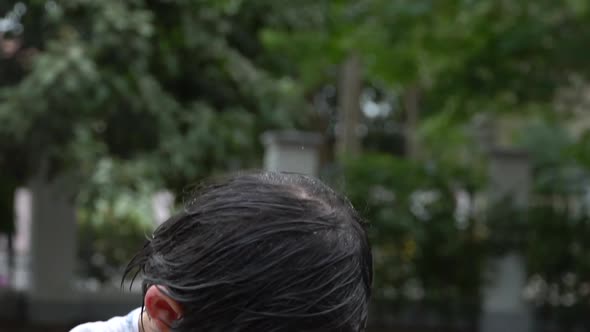 Cute Asian Child Playing With Water Gun In The Summer alt