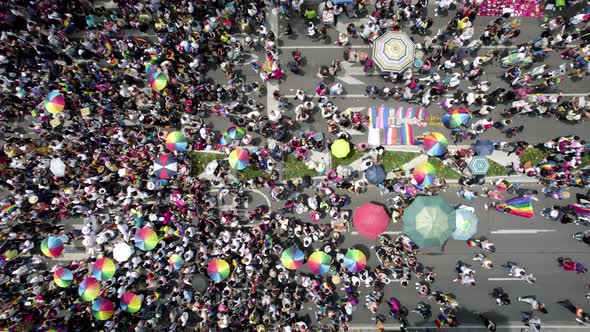 cenital drone shot of a crowd waving the gay pride flag at the pride parade in mexico city during ju alt