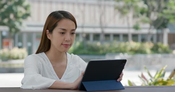 Woman use of tablet at outdoor