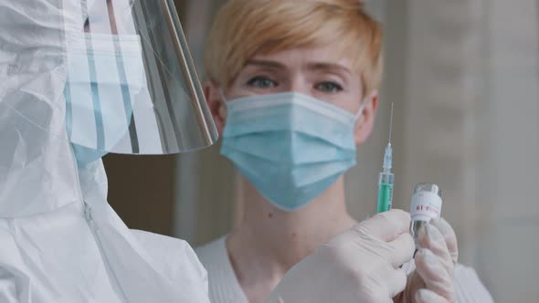 Unrecognizable Female Doctor Medic Nurse Laboratory Assistant Practitioner Holding Bottle with alt