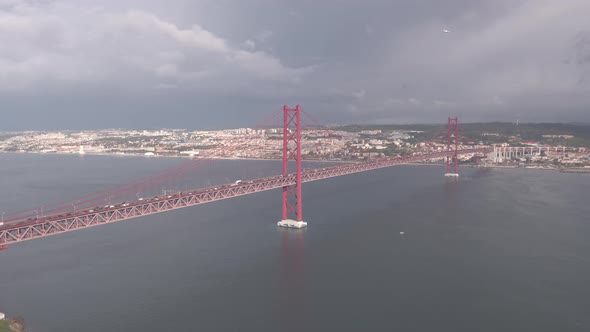 Aerial of the 25 de Abril Bridge on a cloudy day
