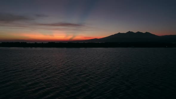 Aerial view of amazing sunset behind a mountain, Gili Trawangan, Indonesia. alt
