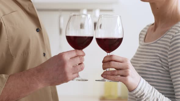 Unrecognizable Spouses Drinking Red Wine And Clinking Glasses Indoors Cropped alt