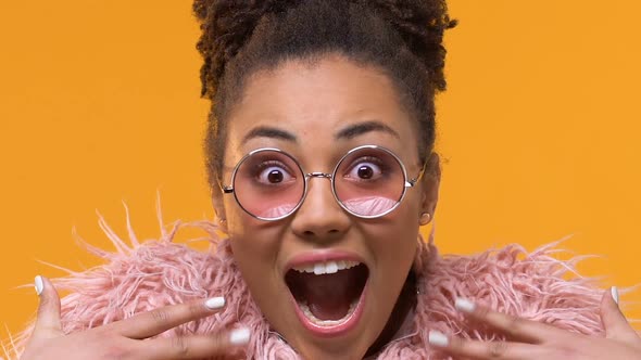Amazed Stylish Female in Pink Eyeglasses Looking Camera, Excitement Expression alt
