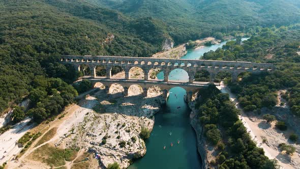 The Pont du Gard is an ancient Roman aqueduct bridge built in the first century AD. It crosses the r alt
