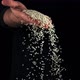 A Handful of Uncooked Rice Falls From a Man&#39;s Hand - VideoHive Item for Sale