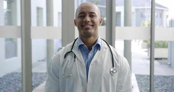 Young male doctor smiling at camera 4k alt