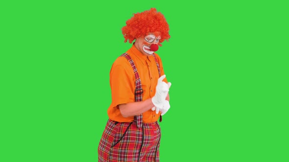 Clown Using Imaginary Digital or Virtual Screen on a Green Screen Chroma Key alt