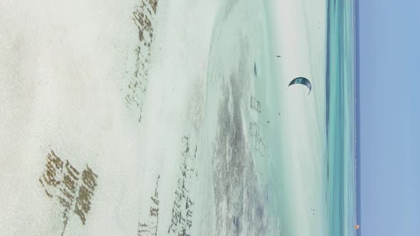 Zanzibar Tanzania  Vertical Video Kitesurfing Near the Shore of Ocean Slow Motion alt