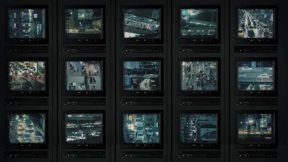 CCTV Screens Showing City At Night alt