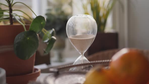 Hourglass sand falling in slow motion alt