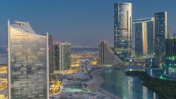 Buildings on Al Reem Island in Abu Dhabi Day to Night Timelapse From Above alt