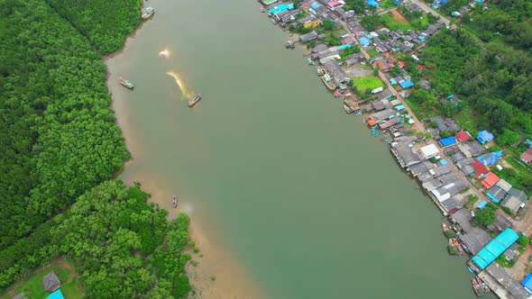 Aerial Shot of Local Fisherman Village Beside the sea. alt