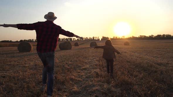 Playful Dad and Son Flying While Running alt