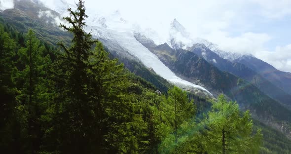 Alpine Mountain. Foggy Landscape. Snowy Peaks in Chamonix. Northern French and Swiss Rustic Scene