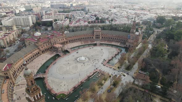 Aerial orbit of Plaza de Espana, Spain Square, with city view; Seville