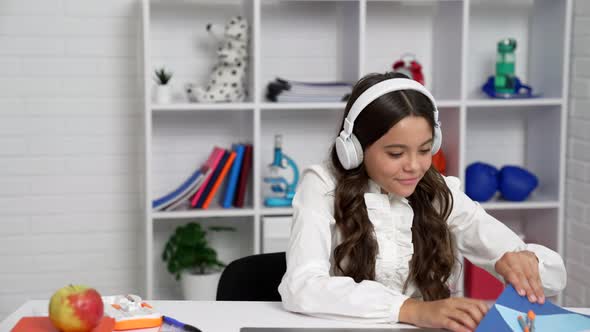 Bored Pupil Girl in Headphones Happily Started to Make Selfie on Smartphone at Lesson School Break