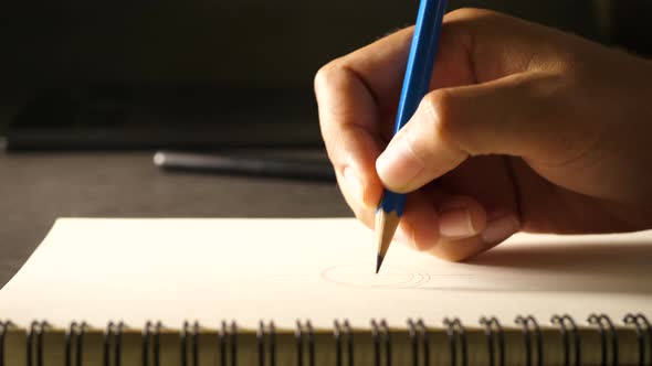 Hand drawing a flat line with a black pencil alt