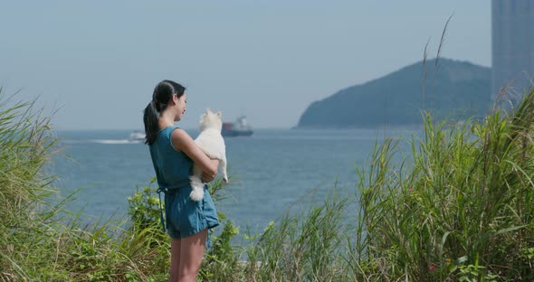 Woman go hiking with her dog