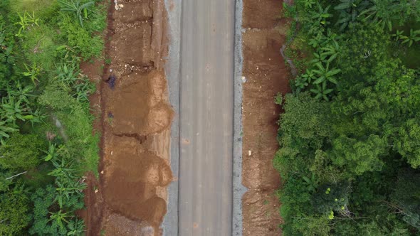 Land clearing for highways from aerial drone footage of upward movement alt