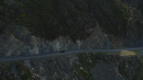 Traffic cars on Chuya highway road between mountains and Katun river in Altai