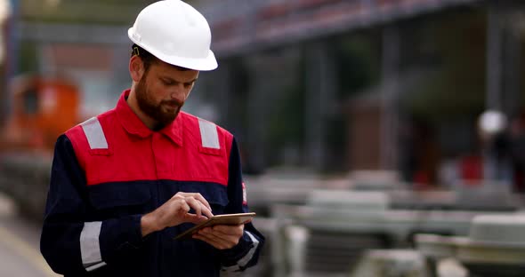 Construction Engineer Using Tablet alt