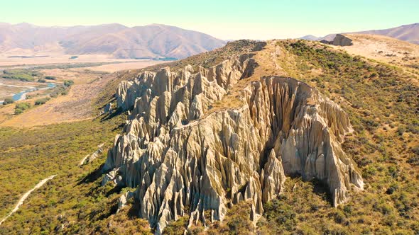 Aerial view of Clay Cliffs, touristic destination at Otago, New Zealand. alt