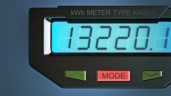 Digital electricity meter showing household consumption in kilowatt hours. alt