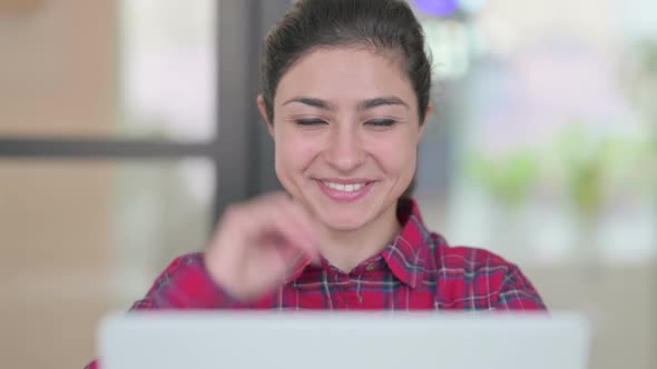 Close Up of Indian Woman with Laptop Showing Thumbs Up alt