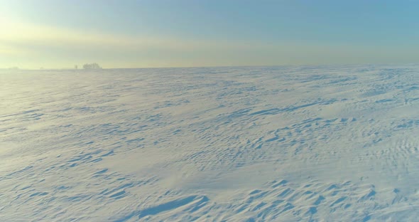 Aerial View of Cold Winter Landscape Arctic Field Trees Covered with Frost Snow Ice River and Sun alt