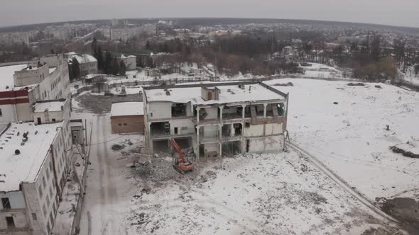 Rotation The Excavator Is Dismantling The Concrete Structures Of The Building alt