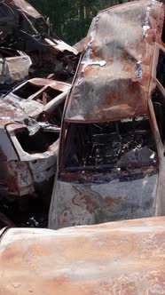 Vertical Video of Burnt Cars During the War in Ukraine alt
