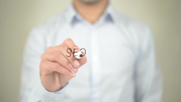 SEO Tags Optimization, Businessman Writing on Transparent Screen alt