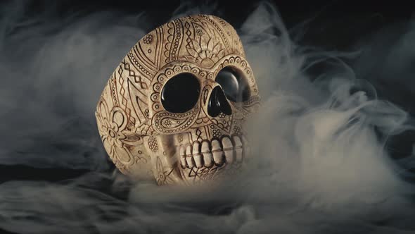 Skull Covered In Smoke On A Dark Background
