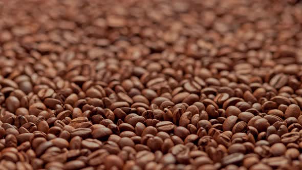 Full Frame Looped Spinning Background of Roasted Coffee Beans