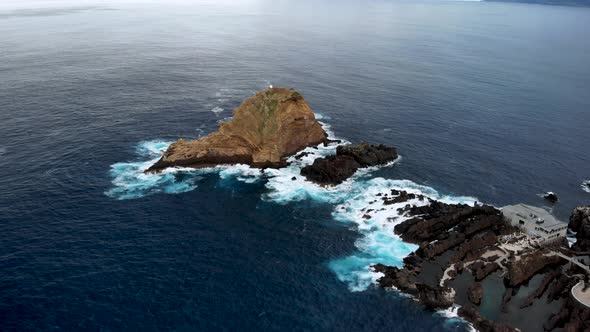 Drone Flying Over Ilheu Mole Cliff near Porto Moniz, Madeira Island, Portugal alt