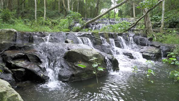 Beautiful stream and waterfall in tropical forest at Namtok Samlan National Park, Saraburi, Thailand