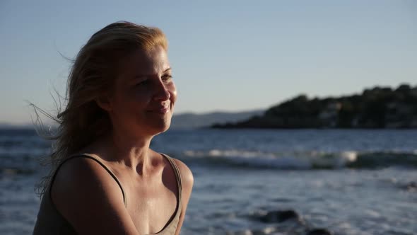 Slow motion of woman relaxing by the sea  1080p FullHD footage - Beautiful self-confident blonde on  alt