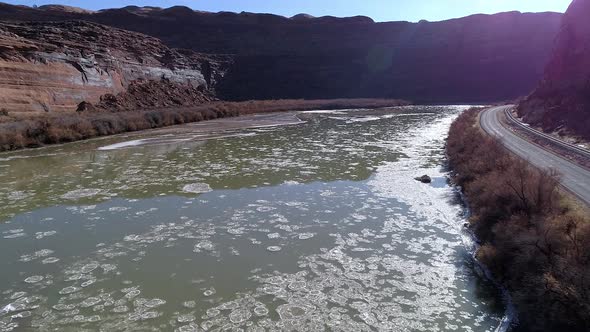 Flying over the Colorado River as broken ice floats down the river alt