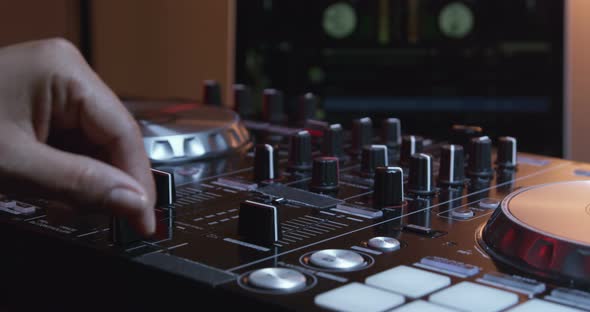 Hands Of DJ Controlling Digital Mixer 06b